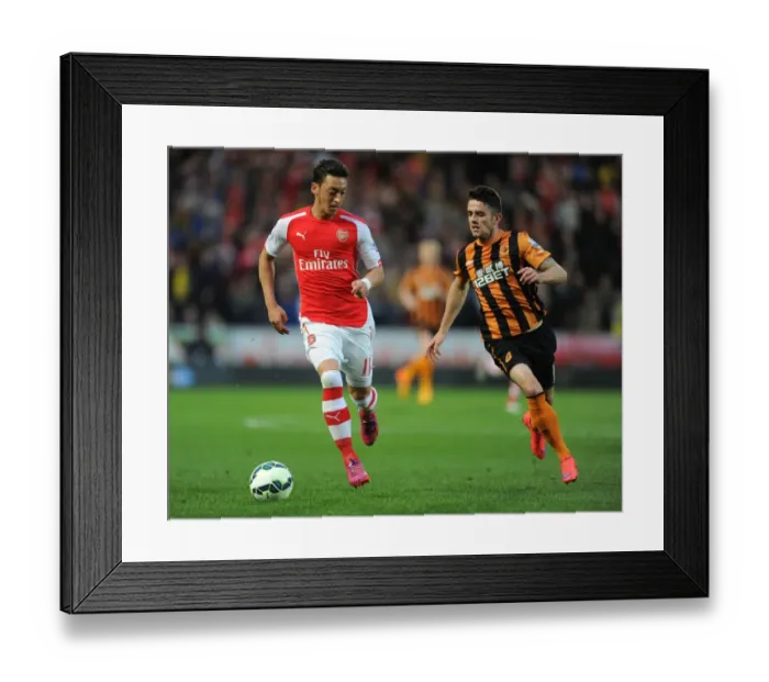 Framed Print : Mesut Ozil vs. Robert Snodgrass: A Premier League Showdown at KC Stadium