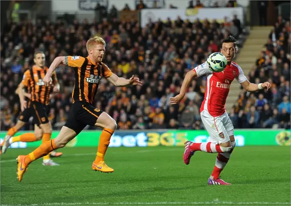Mesut Ozil vs. Paul McShane: A Battle of Skills in the Intense Hull City vs. Arsenal Clash, Premier League 2014 / 15