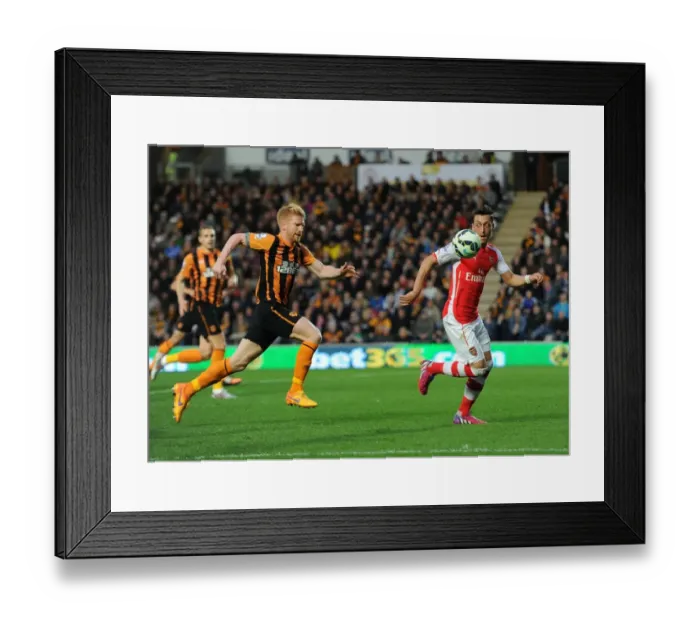 Framed Print : Mesut Ozil vs. Paul McShane: A Battle of Skills in the Intense Hull City vs. Arsenal Clash, Premier League 2014 / 15