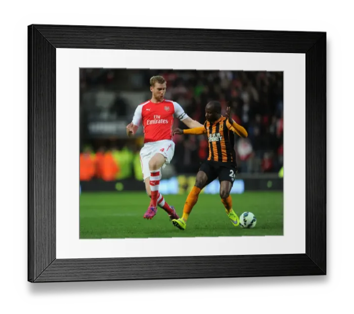 Framed Print : Per Mertesacker vs. Sone Aluko: Intense Tackle in Arsenal's Victory over Hull City, Premier League 2014 / 15