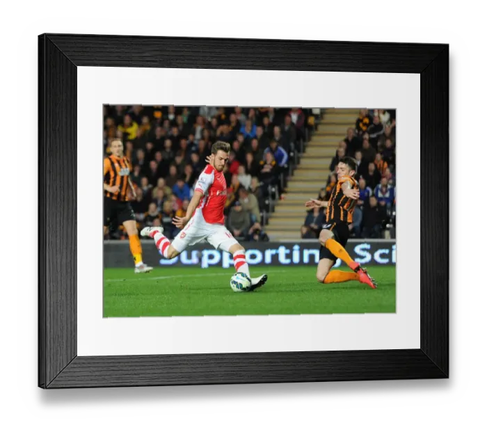 Framed Print : Aaron Ramsey scores Arsenals 2nd goal under pressure from Robbie Brady (Hull) Framed Print : Aaron Ramsey scores Arsenals 2nd goal under pressure from Robbie Brady (Hull)