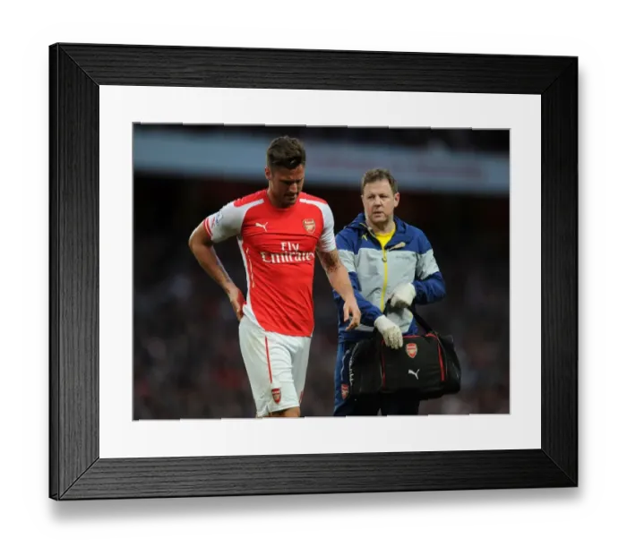 Framed Print : Arsenal's Olivier Giroud Receives Attention from Physio Colin Lewin during Swansea City Match, 2014 / 15 Season