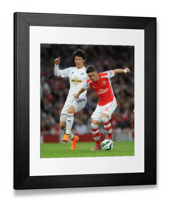 Framed Print : Mesut Ozil vs. Ki Sung-Yueng: A Premier League Battle at Emirates Stadium, 2015 Framed Print : Mesut Ozil vs. Ki Sung-Yueng: A Premier League Battle at Emirates Stadium, 2015