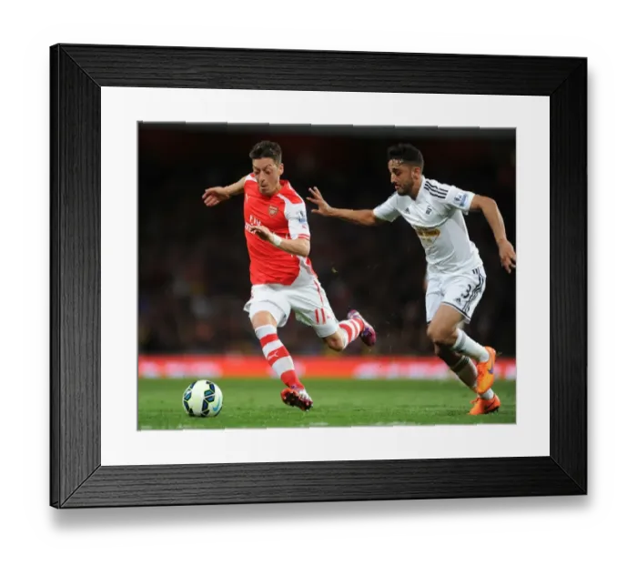 Framed Print : Intense Battle: Mesut Ozil vs. Neil Taylor at Arsenal's Emirates Stadium (Arsenal vs. Swansea City, Premier League 2014 / 15) Framed Print : Intense Battle: Mesut Ozil vs. Neil Taylor at Arsenal's Emirates Stadium (Arsenal vs. Swansea City, Premier League 2014 / 15)