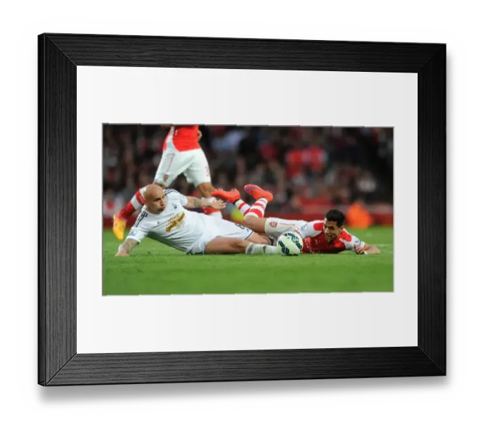Framed Print : Arsenal's Alexis Sanchez vs Swansea's Jonjo Shelvey: Foul Clash in 2014 / 15 Premier League Match Framed Print : Arsenal's Alexis Sanchez vs Swansea's Jonjo Shelvey: Foul Clash in 2014 / 15 Premier League Match