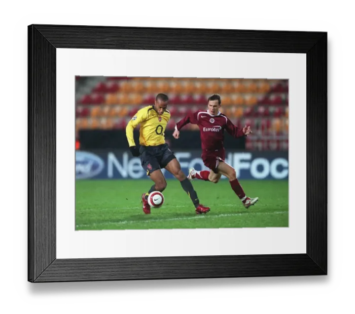Framed Print : Thierry Henry: Arsenal's Legendary Striker Breaks All-Time Goal Scoring Record with 186th Goal vs. Sparta Prague in the UEFA Champions League Framed Print : Thierry Henry: Arsenal's Legendary Striker Breaks All-Time Goal Scoring Record with 186th Goal vs. Sparta Prague in the UEFA Champions League