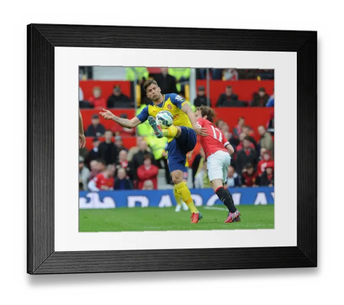Framed Print : Giroud vs Blind: A Premier League Battle at Old Trafford Framed Print : Giroud vs Blind: A Premier League Battle at Old Trafford
