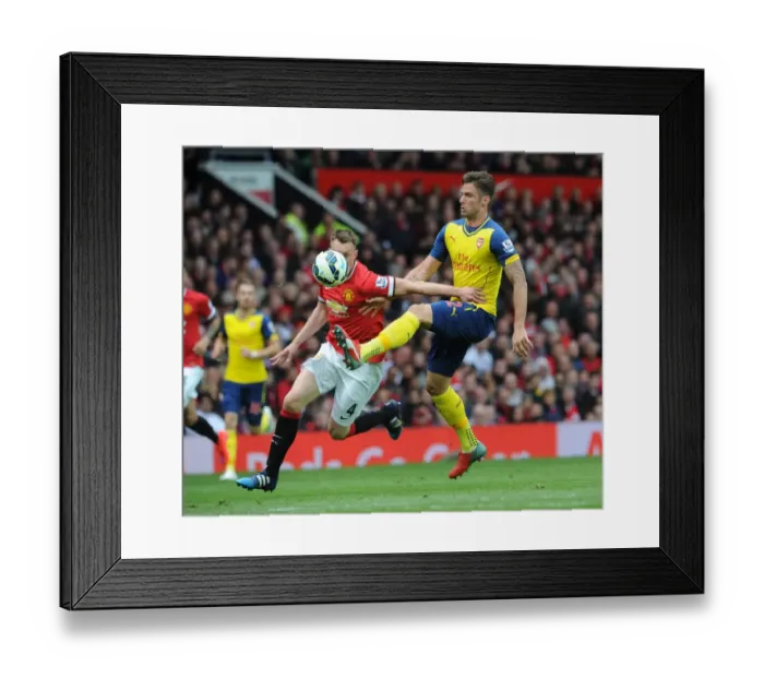Framed Print : Giroud vs Jones: A Premier League Showdown at Old Trafford, 2014-15 Framed Print : Giroud vs Jones: A Premier League Showdown at Old Trafford, 2014-15