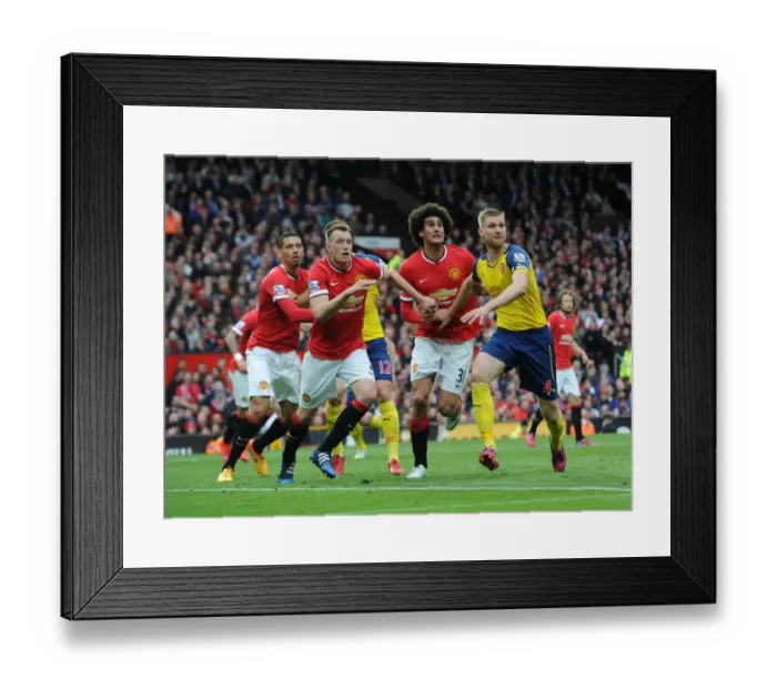 Framed Print : Clash of Titans: Mertesacker vs. Jones & Fellaini - Manchester United vs. Arsenal, Premier League 2014-15: A Battle of Strength and Skill