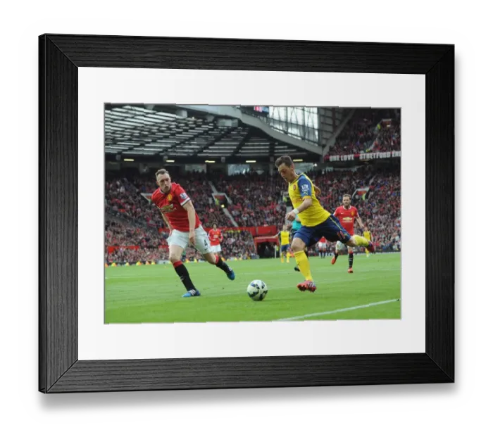Framed Print : Mesut Ozil vs. Phil Jones: A Premier League Showdown at Old Trafford (Arsenal vs. Manchester United, 2014-15) Framed Print : Mesut Ozil vs. Phil Jones: A Premier League Showdown at Old Trafford (Arsenal vs. Manchester United, 2014-15)