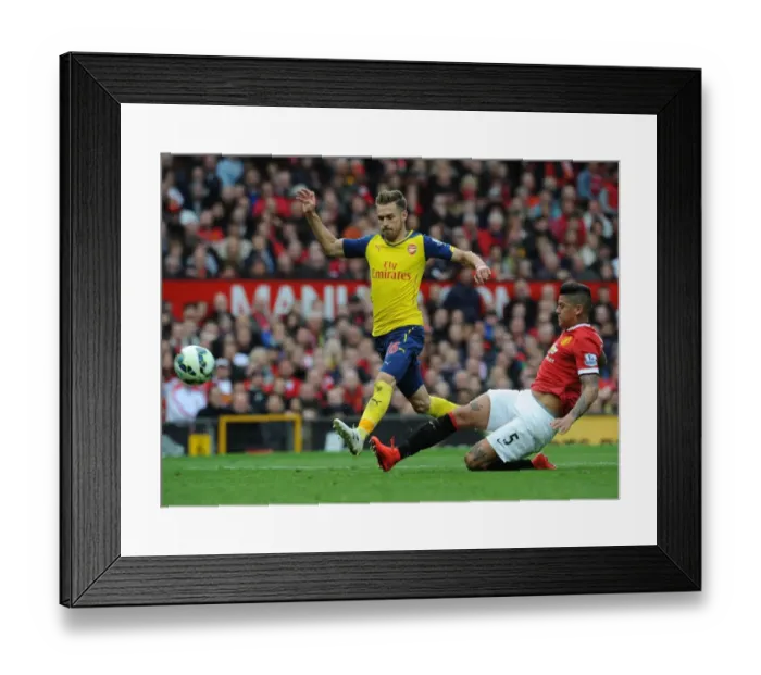 Framed Print : Ramsey vs. Rojo: A Premier League Battle at Old Trafford Framed Print : Ramsey vs. Rojo: A Premier League Battle at Old Trafford
