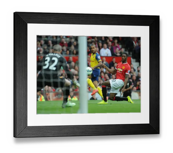 Framed Print : Dramatic: Theo Walcott Scores Past Tyler Blackett in Manchester United vs. Arsenal (2014-15) Framed Print : Dramatic: Theo Walcott Scores Past Tyler Blackett in Manchester United vs. Arsenal (2014-15)