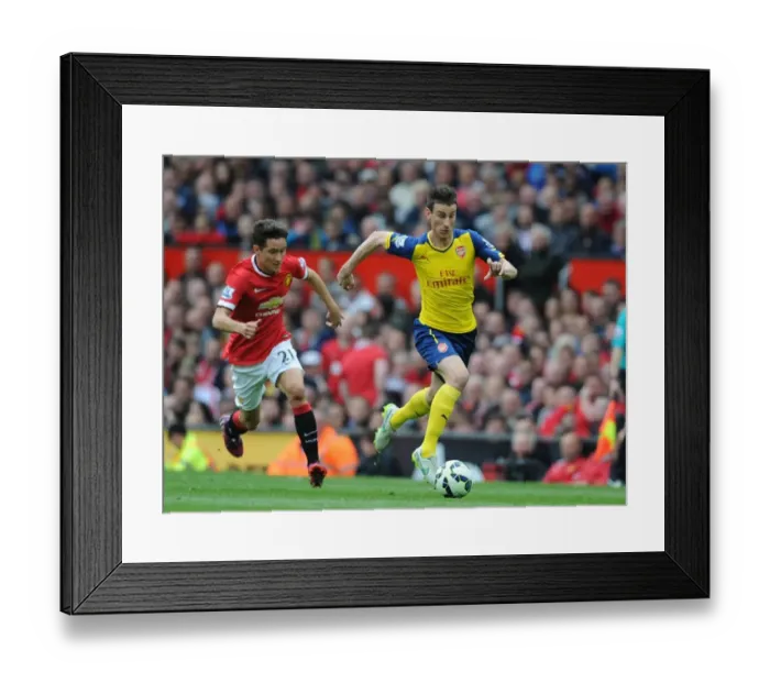 Framed Print : Arsenal's Koscielny Outmaneuvers Herrera in Intense Premier League Showdown (2014-15)