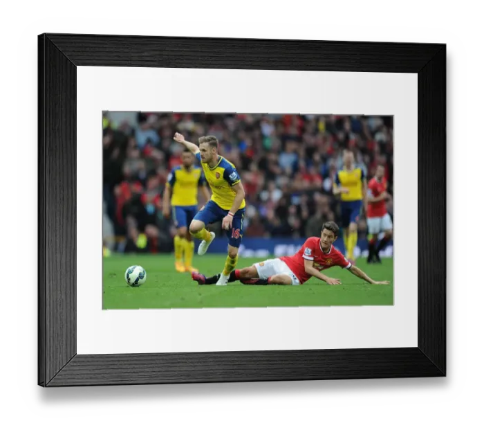 Framed Print : Ramsey Surges Past Herrera: Manchester United vs. Arsenal, Premier League Clash (2014-15) Framed Print : Ramsey Surges Past Herrera: Manchester United vs. Arsenal, Premier League Clash (2014-15)