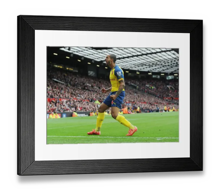Framed Print : Dramatic Moment: Theo Walcott Scores the Winning Goal Against Manchester United in the Premier League 2014-15 Framed Print : Dramatic Moment: Theo Walcott Scores the Winning Goal Against Manchester United in the Premier League 2014-15
