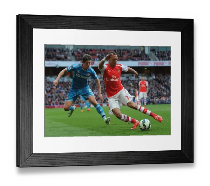 Framed Print : Arsenal's Kieran Gibbs Faces Off Against Sunderland's Billy Jones in Intense Premier League Clash