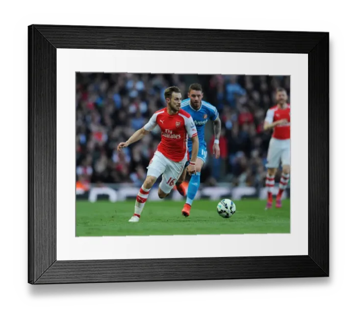 Framed Print : Arsenal's Aaron Ramsey in Action: Arsenal vs. Sunderland (2014-15) Framed Print : Arsenal's Aaron Ramsey in Action: Arsenal vs. Sunderland (2014-15)