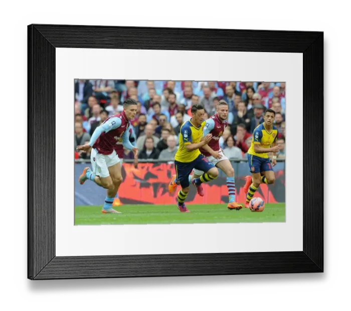 Framed Print : Mesut Ozil (Arsenal) Jack Grealish and Tom Cleverly (Villa). Arsenal 4: 0 Aston Villa
