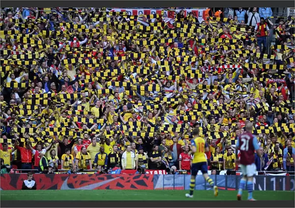 Arsenal fans hold up there scarves during the match. Arsenal 4: 0 Aston Villa. FA Cup Final