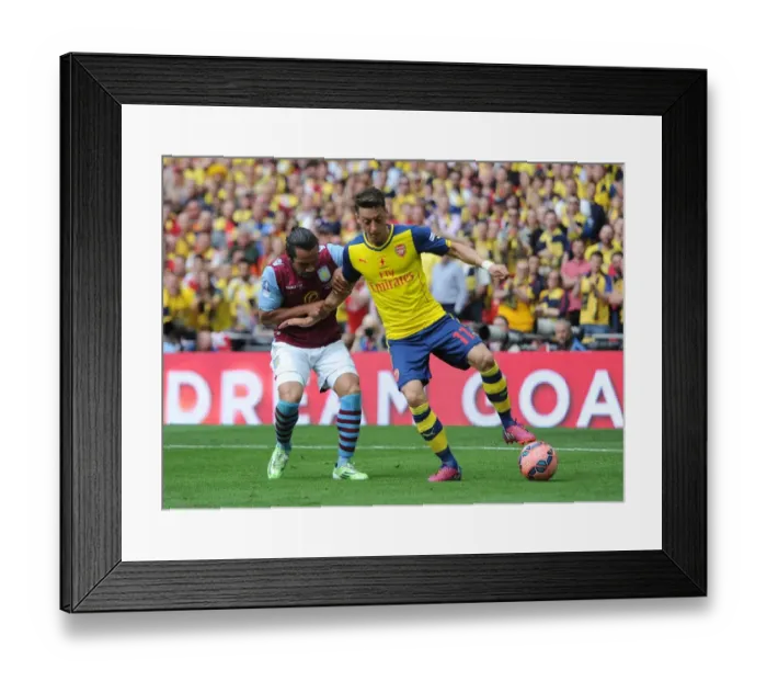 Framed Print : Mesut Ozil (Arsenal) Kieran Richardson (Villa). Arsenal 4: 0 Aston Villa. FA Cup Final Framed Print : Mesut Ozil (Arsenal) Kieran Richardson (Villa). Arsenal 4: 0 Aston Villa. FA Cup Final