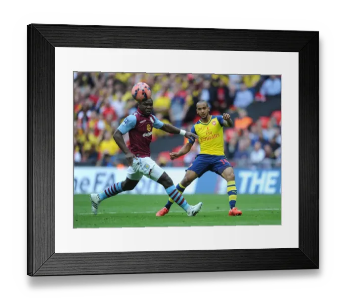 Framed Print : Theo Walcott (Arsenal). Jores Okore (Villa). Arsenal 4: 0 Aston Villa. FA Cup Final
