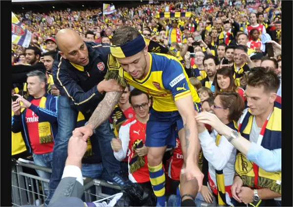 Jack Wilshere (Arsenal) climbs out of the crowd. Arsenal 4: 0 Aston Villa. FA Cup Final