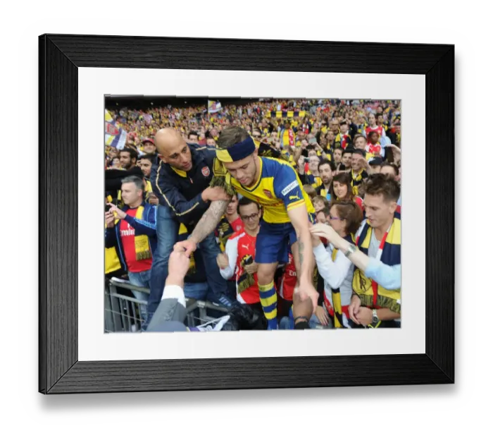 Framed Print : Jack Wilshere (Arsenal) climbs out of the crowd. Arsenal 4: 0 Aston Villa. FA Cup Final
