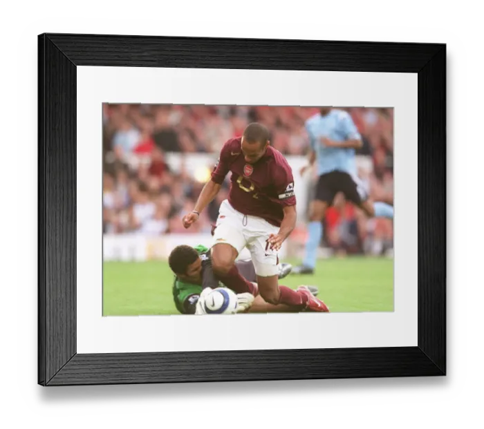 Framed Print : Thierry Henry (Arsenal) is tripped by David James (Man City) for the Arsenal penalty