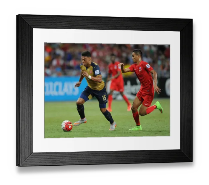 Framed Print : Alex Oxlade-Chamberlain (Arsenal). Arsenal 4: 0 Singapore XI. Barclays Asia Tour. Singapore Framed Print : Alex Oxlade-Chamberlain (Arsenal). Arsenal 4: 0 Singapore XI. Barclays Asia Tour. Singapore