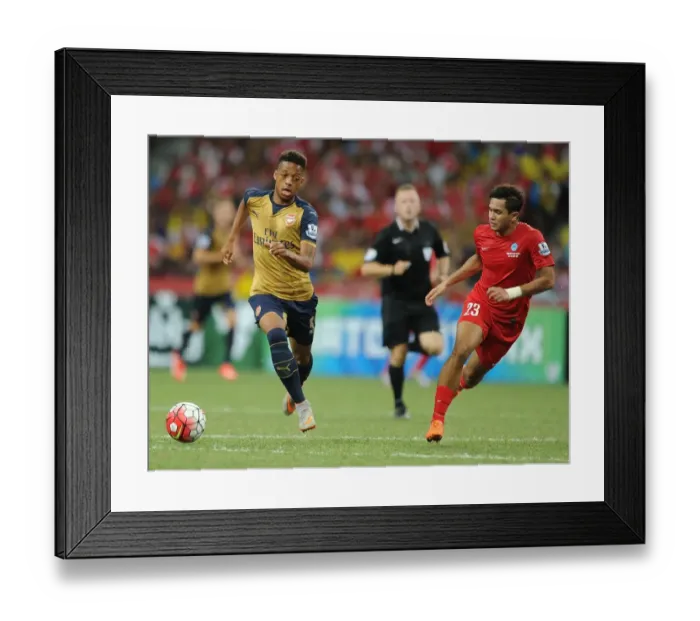 Framed Print : Arsenal vs Singapore XI: Barclays Asia Trophy Clash - Arsenal's Chris Willock Faces Off Against Zulfahim Arifin in Singapore (July 15, 2015)