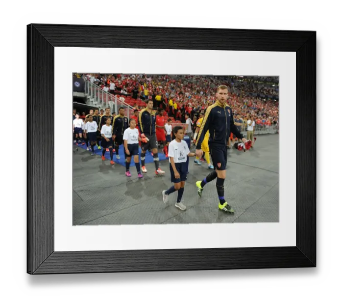 Framed Print : Arsenal's Per Mertesacker Leads Team Out in Arsenal v Singapore XI Match, Kallang, Singapore (July 15, 2015)