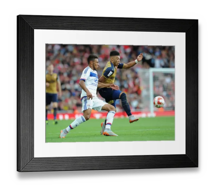 Framed Print : Clash of Midfielders: Oxlade-Chamberlain vs. Tolisso in Arsenal's Emirates Cup Match Framed Print : Clash of Midfielders: Oxlade-Chamberlain vs. Tolisso in Arsenal's Emirates Cup Match