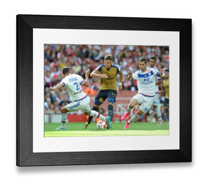 Framed Print : Mesut Ozil vs. Mehdi Zeffane & Maxime Gonalons: Intense Face-Off at Arsenal vs. Olympique Lyonnais (Emirates Cup 2015 / 16) Framed Print : Mesut Ozil vs. Mehdi Zeffane & Maxime Gonalons: Intense Face-Off at Arsenal vs. Olympique Lyonnais (Emirates Cup 2015 / 16)