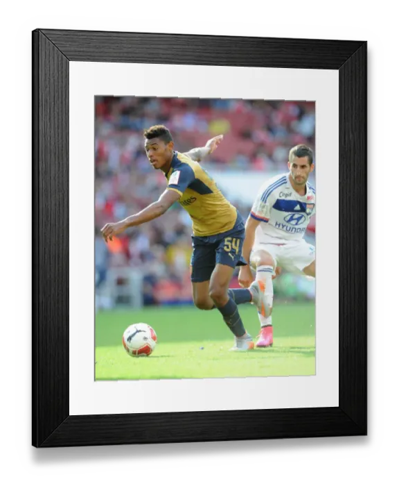 Framed Print : Reine-Adelaide vs. Gonalons: A Clash of Midfield Titans at the Emirates Cup