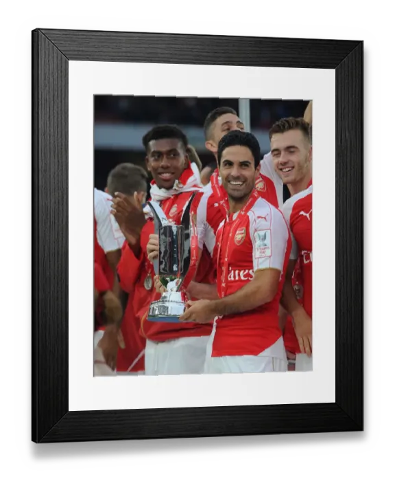Framed Print : Arsenal Triumph at Emirates Cup: Mikel Arteta's Victory Dance (2015)