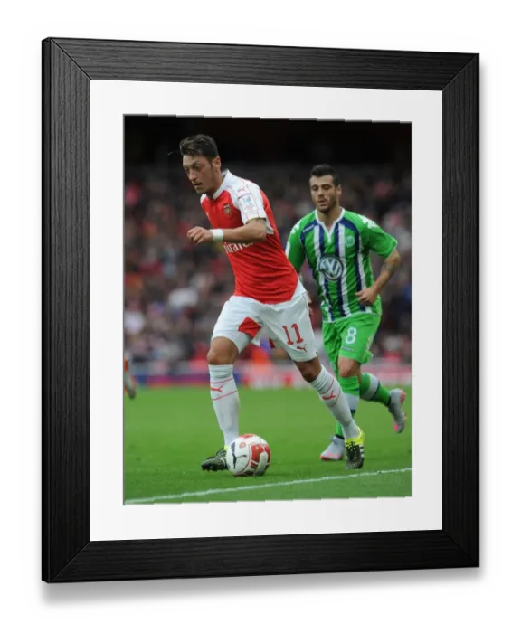 Framed Print : Mesut Ozil's Stellar Performance: Arsenal's Emirates Cup Victory over VfL Wolfsburg