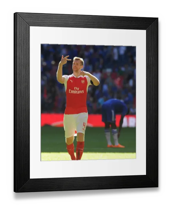 Framed Print : Arsenal's Per Mertesacker Leads the Celebration: Community Shield Victory over Chelsea Framed Print : Arsenal's Per Mertesacker Leads the Celebration: Community Shield Victory over Chelsea