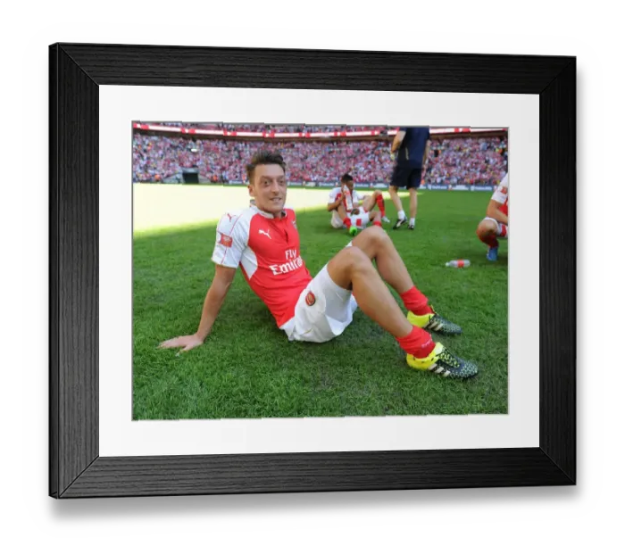 Framed Print : Arsenal's Mesut Ozil Celebrates FA Community Shield Victory over Chelsea Framed Print : Arsenal's Mesut Ozil Celebrates FA Community Shield Victory over Chelsea