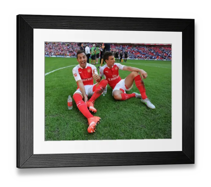 Framed Print : Arsenal Celebrate Community Shield Victory over Chelsea (2015): Santi Cazorla and Laurent Koscielny Rejoice Framed Print : Arsenal Celebrate Community Shield Victory over Chelsea (2015): Santi Cazorla and Laurent Koscielny Rejoice