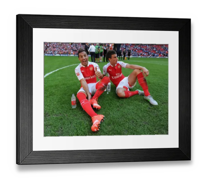 Framed Print : Arsenal Celebrate Community Shield Victory over Chelsea (2015): Santi Cazorla and Laurent Koscielny Rejoice Framed Print : Arsenal Celebrate Community Shield Victory over Chelsea (2015): Santi Cazorla and Laurent Koscielny Rejoice
