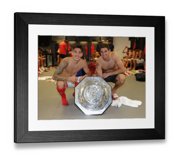 Framed Print : Arsenal's Hector Bellerin and Emiliano Martinez Celebrate Community Shield Victory over Chelsea Framed Print : Arsenal's Hector Bellerin and Emiliano Martinez Celebrate Community Shield Victory over Chelsea