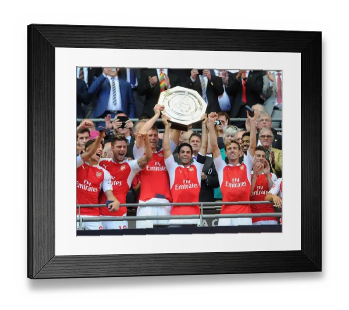 Framed Print : Arsenal's Winning Squad: Mertesacker, Arteta, Monreal, and Giroud Celebrate Community Shield Victory