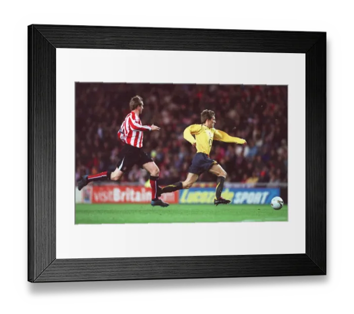 Framed Print : Arturo Lupoli (Arsenal) Steven Caldwell (Sunderland). Sunderland 0: 3 Arsenal Framed Print : Arturo Lupoli (Arsenal) Steven Caldwell (Sunderland). Sunderland 0: 3 Arsenal