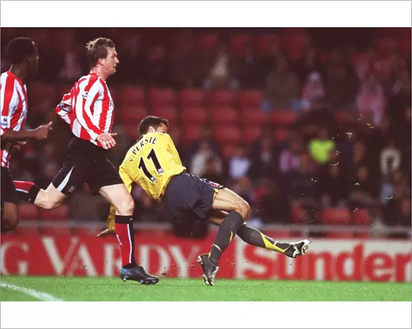 Robin van Persie scores Arsenals 3rd goal his 2nd under pressure from Steven Caldwell