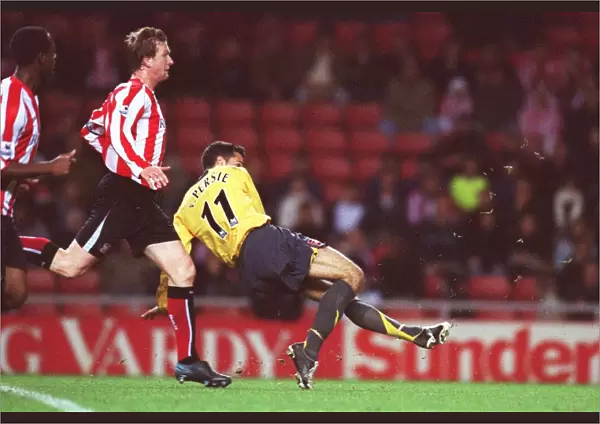 Robin van Persie scores Arsenals 3rd goal his 2nd under pressure from Steven Caldwell