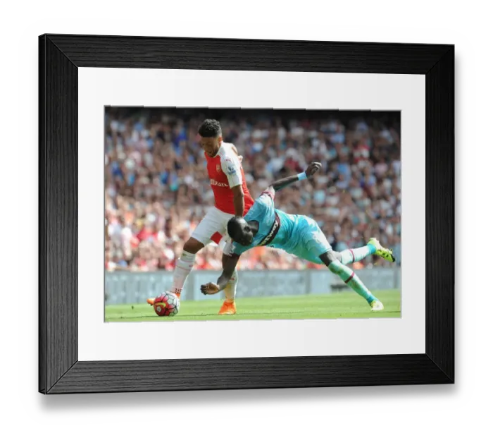Framed Print : Clash of the Midfield Titans: Oxlade-Chamberlain vs. Kouyate in Arsenal vs. West Ham Showdown Framed Print : Clash of the Midfield Titans: Oxlade-Chamberlain vs. Kouyate in Arsenal vs. West Ham Showdown