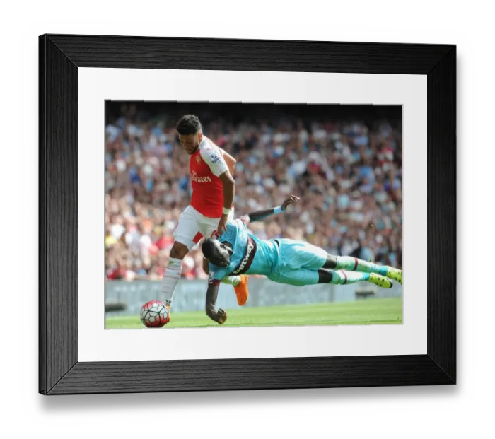 Framed Print : Oxlade-Chamberlain vs. Kouyate: A Premier League Battle at Arsenal Framed Print : Oxlade-Chamberlain vs. Kouyate: A Premier League Battle at Arsenal