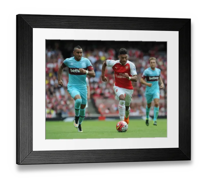 Framed Print : Oxlade-Chamberlain vs. Payet: Clash of the Stars in Arsenal vs. West Ham Premier League Showdown