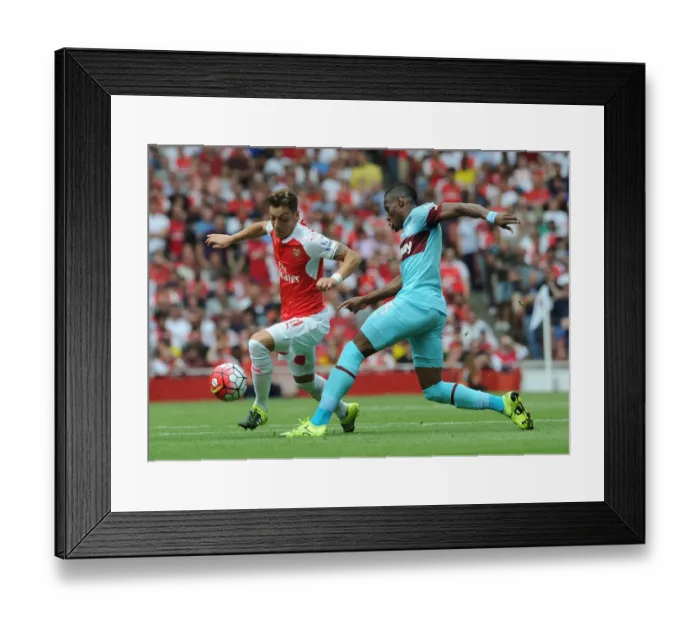 Framed Print : Mesut Ozil Outmaneuvers Diafra Sakho: Arsenal vs West Ham United, Premier League 2015-16