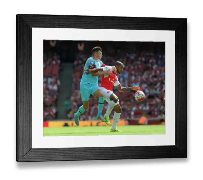 Framed Print : Intense Battle: Walcott vs. Cresswell - Arsenal vs. West Ham Football Rivalry Framed Print : Intense Battle: Walcott vs. Cresswell - Arsenal vs. West Ham Football Rivalry